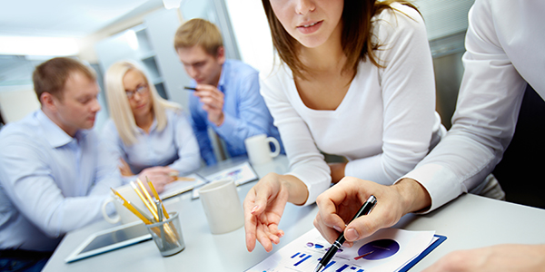 Close-up,Of,Business,Partners,Hands,Over,Document,With,Their,Colleagues
